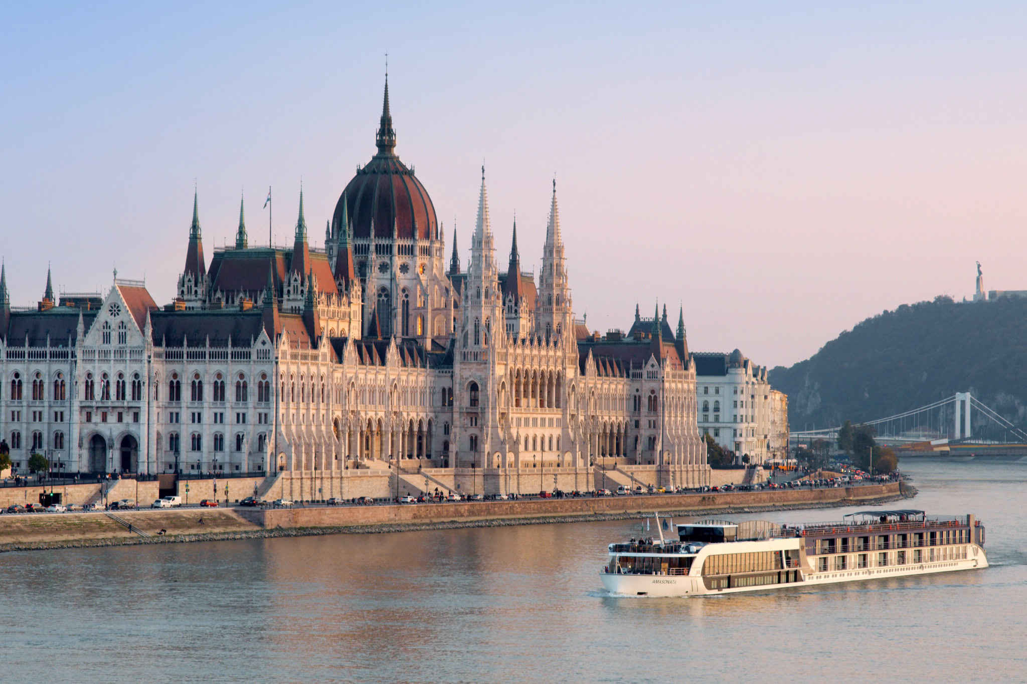 Iconic Hungarian Parliament Building along the Danube River in Budapest, showcasing Gothic Revival architecture.