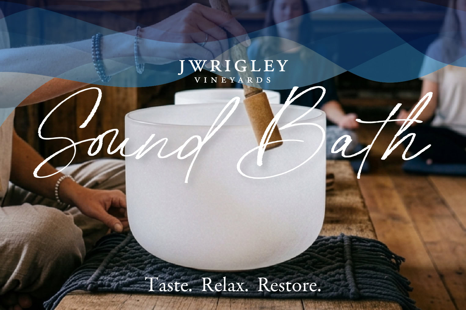 Sound bath at J Wrigley Vineyards with a white singing bowl and people meditating nearby for relaxation.